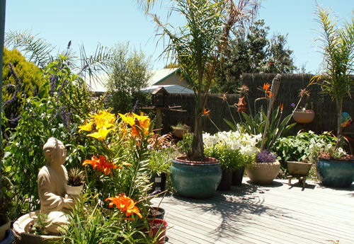 Two storey holiday house with carport and landscaped garden.