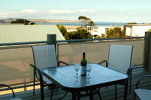 The mainland can be seen across the water.